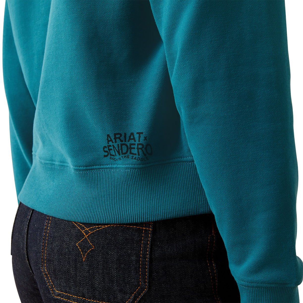 Teal sweatshirt with 'Ariat Sendero' logo on a white background