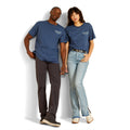 Two people wearing matching blue t-shirts against a white background