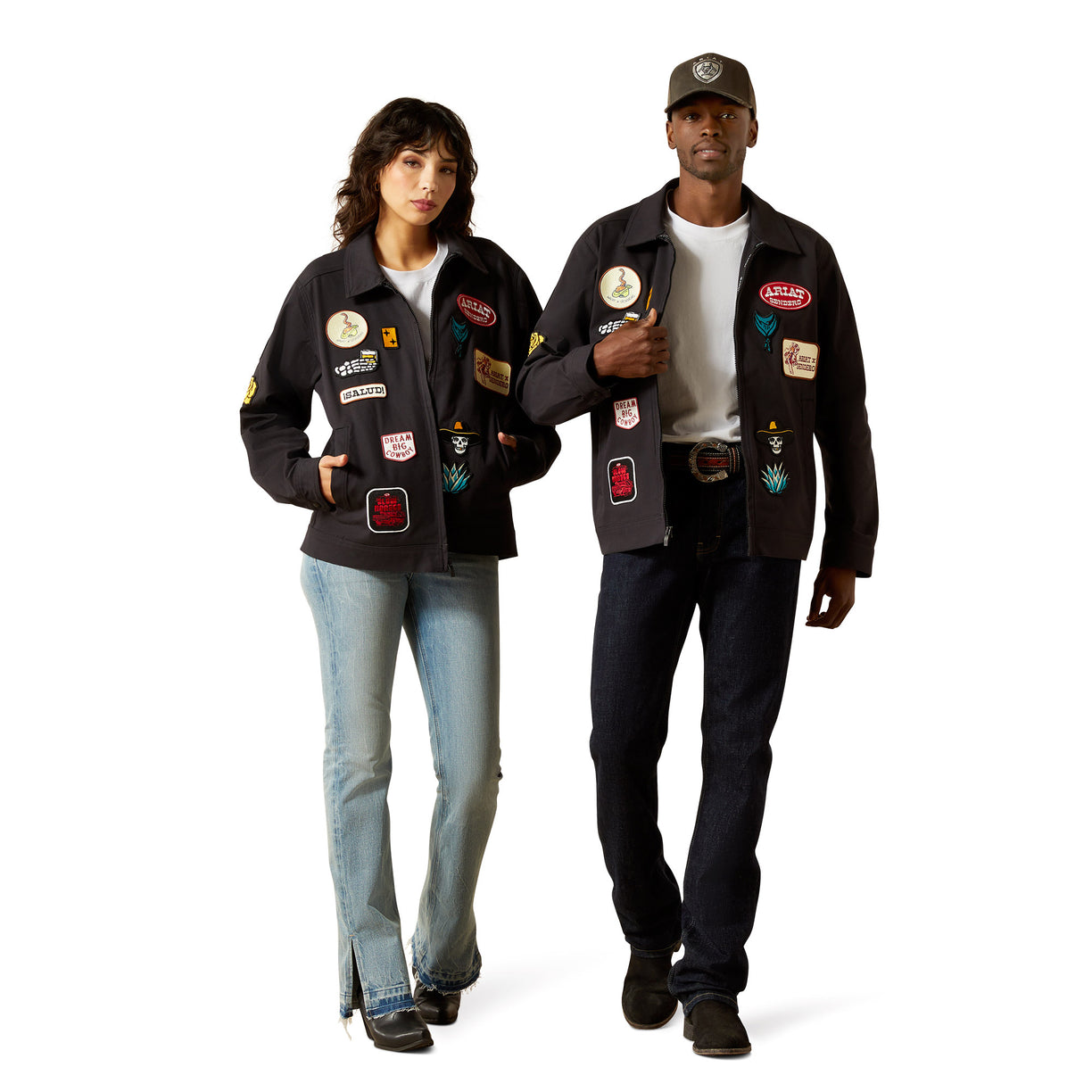 Two people wearing black jackets with various patches on a white background