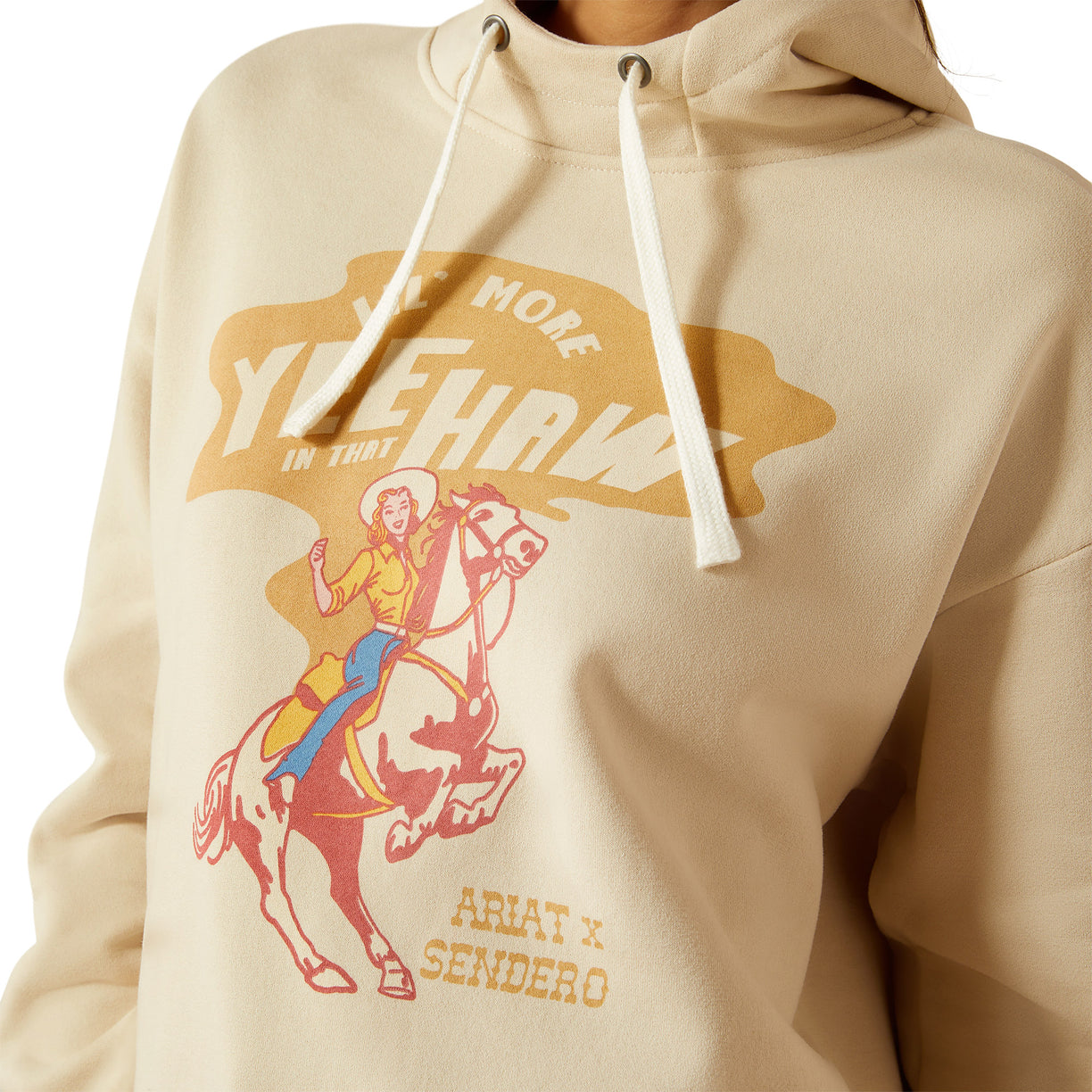 Beige hoodie with graphic design of a person on a horse and text.