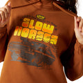 Brown hoodie with 'Slow Horses' graphic design and Ariat branding.