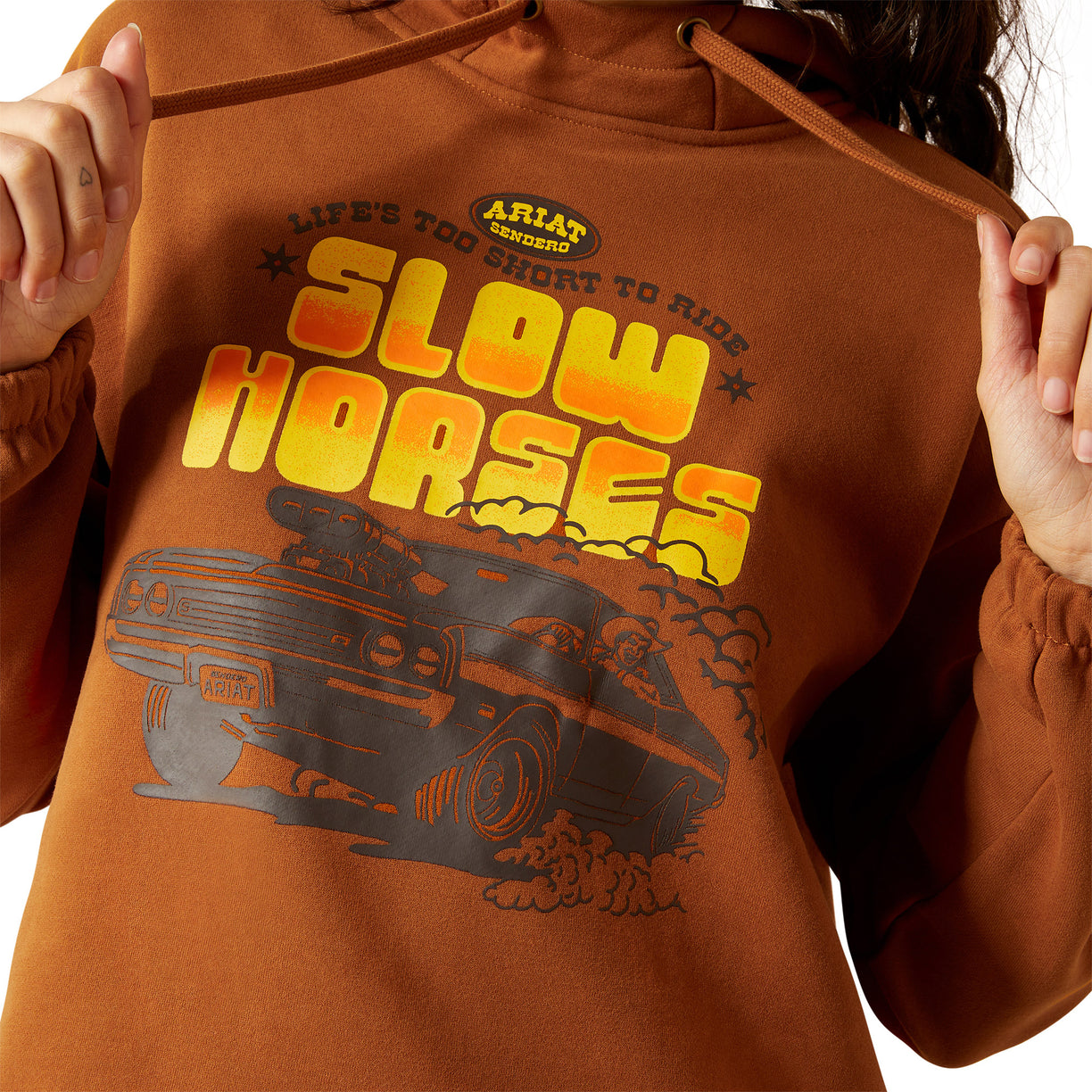Brown hoodie with 'Slow Horses' graphic design and Ariat branding.