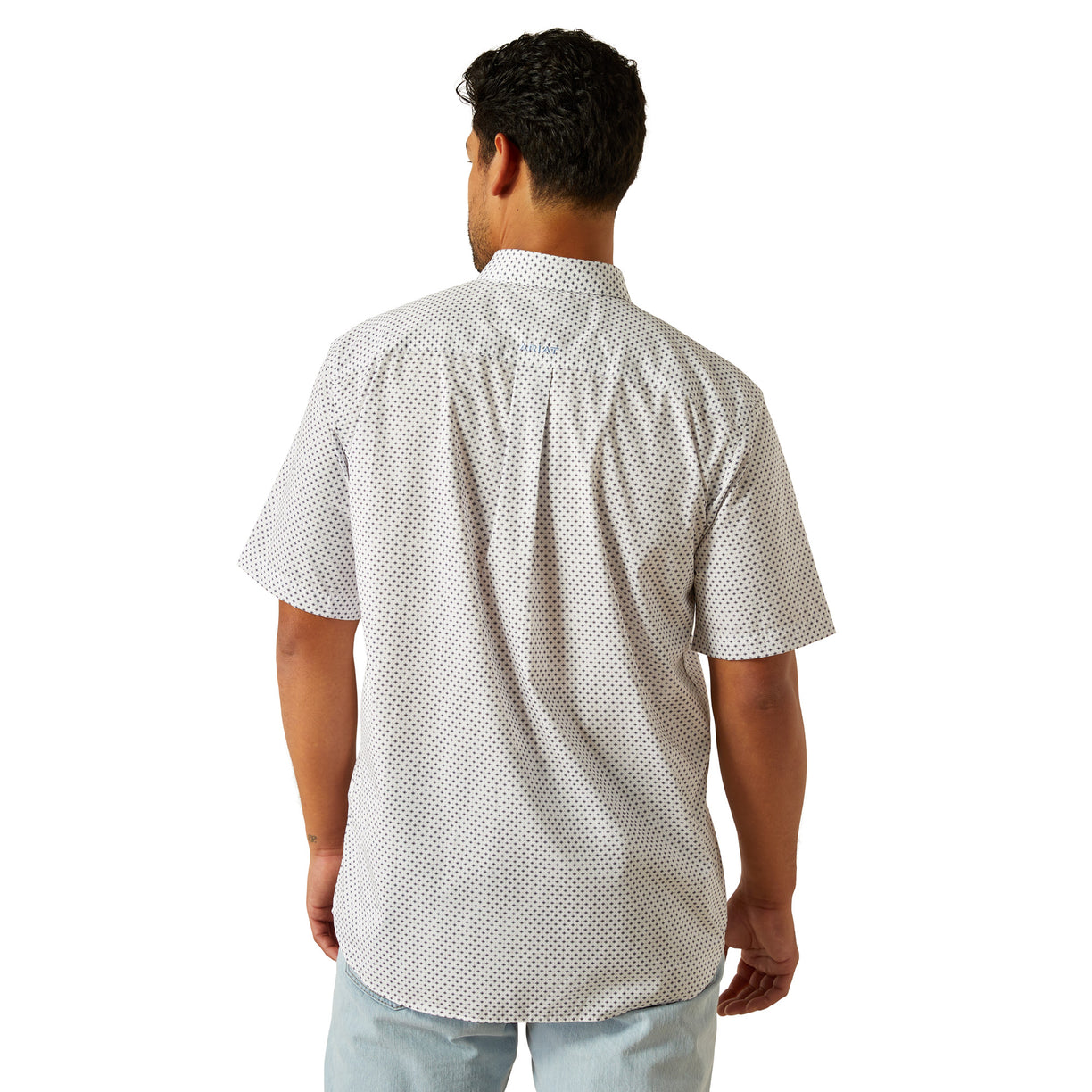 Man wearing a white patterned shirt on a white background
