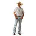 Man wearing a white shirt, light blue jeans, and a cowboy hat on a white background