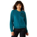 Woman wearing a teal sweatshirt with a graphic design on a white background