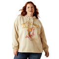 Woman wearing a beige hoodie with graphic design on a white background