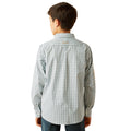 Person wearing a patterned shirt on a white background