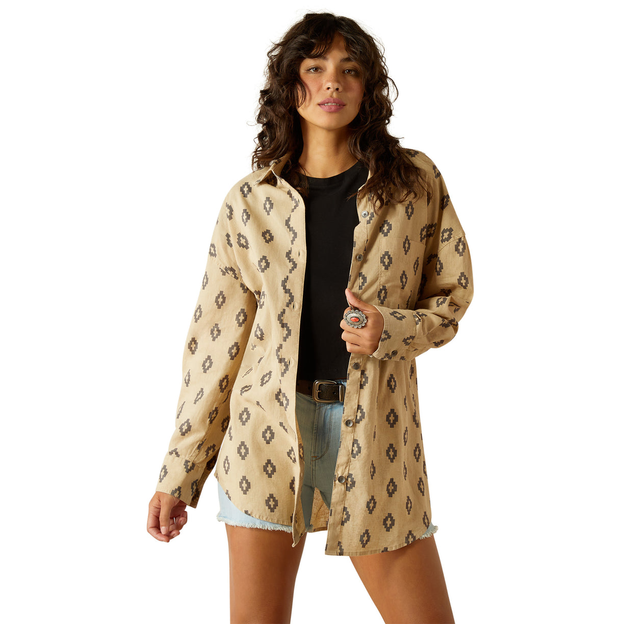 Woman wearing a patterned beige jacket on a white background