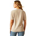 Woman wearing a beige t-shirt and blue jeans on a white background