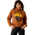 Woman wearing a brown hoodie with 'Slow Horses' text and graphic on a white background