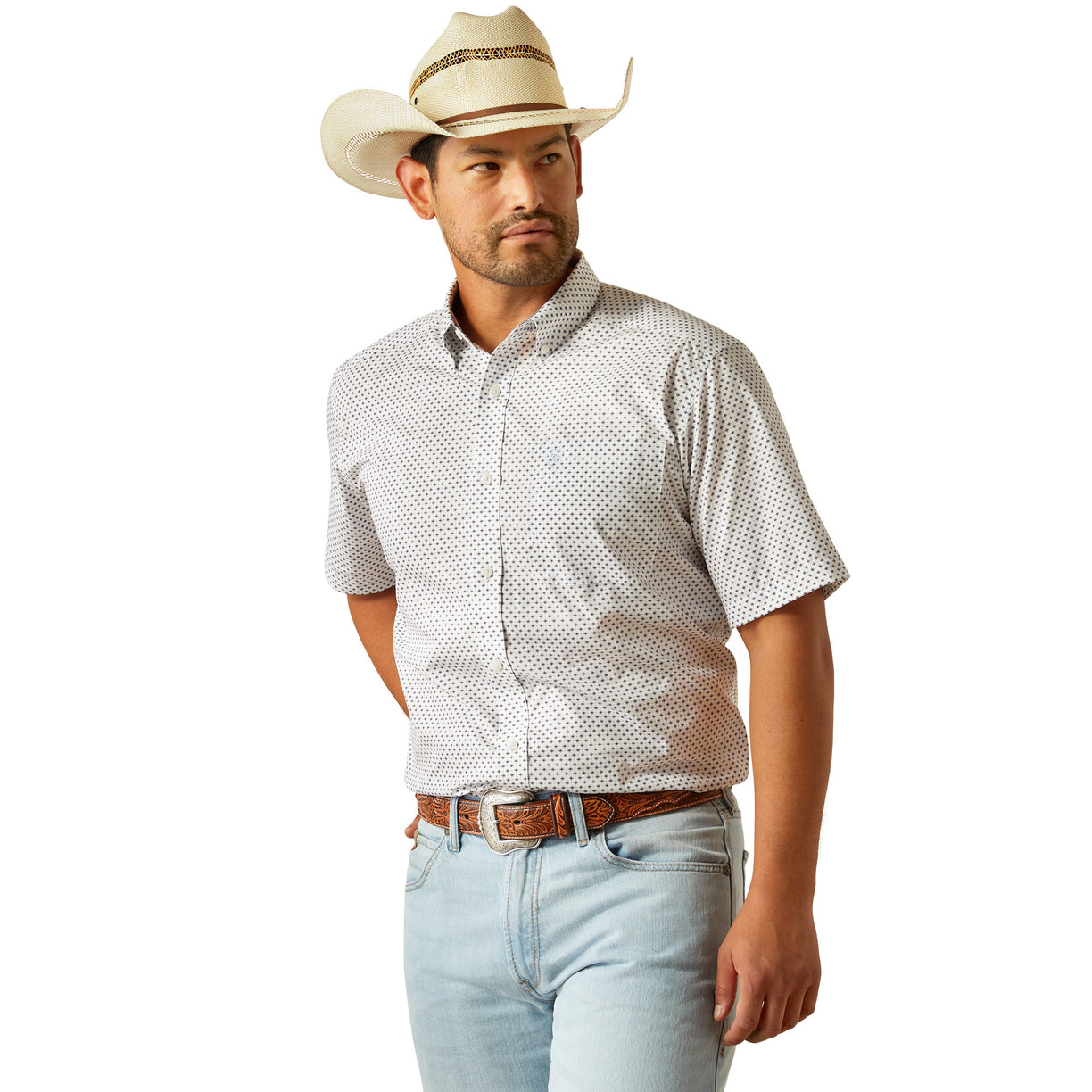 Man wearing a white patterned shirt, light blue jeans, and a beige cowboy hat on a white background