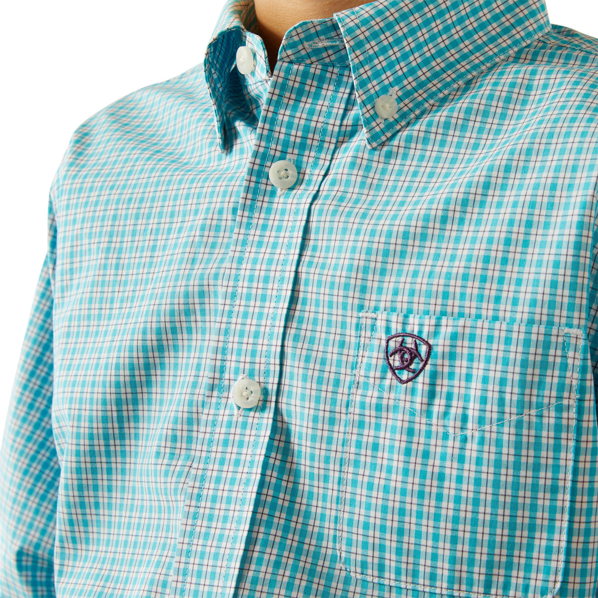 Close-up of a turquoise and white checkered shirt with a brand logo on a white background