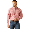Man wearing a pink checkered shirt and blue jeans on a white background