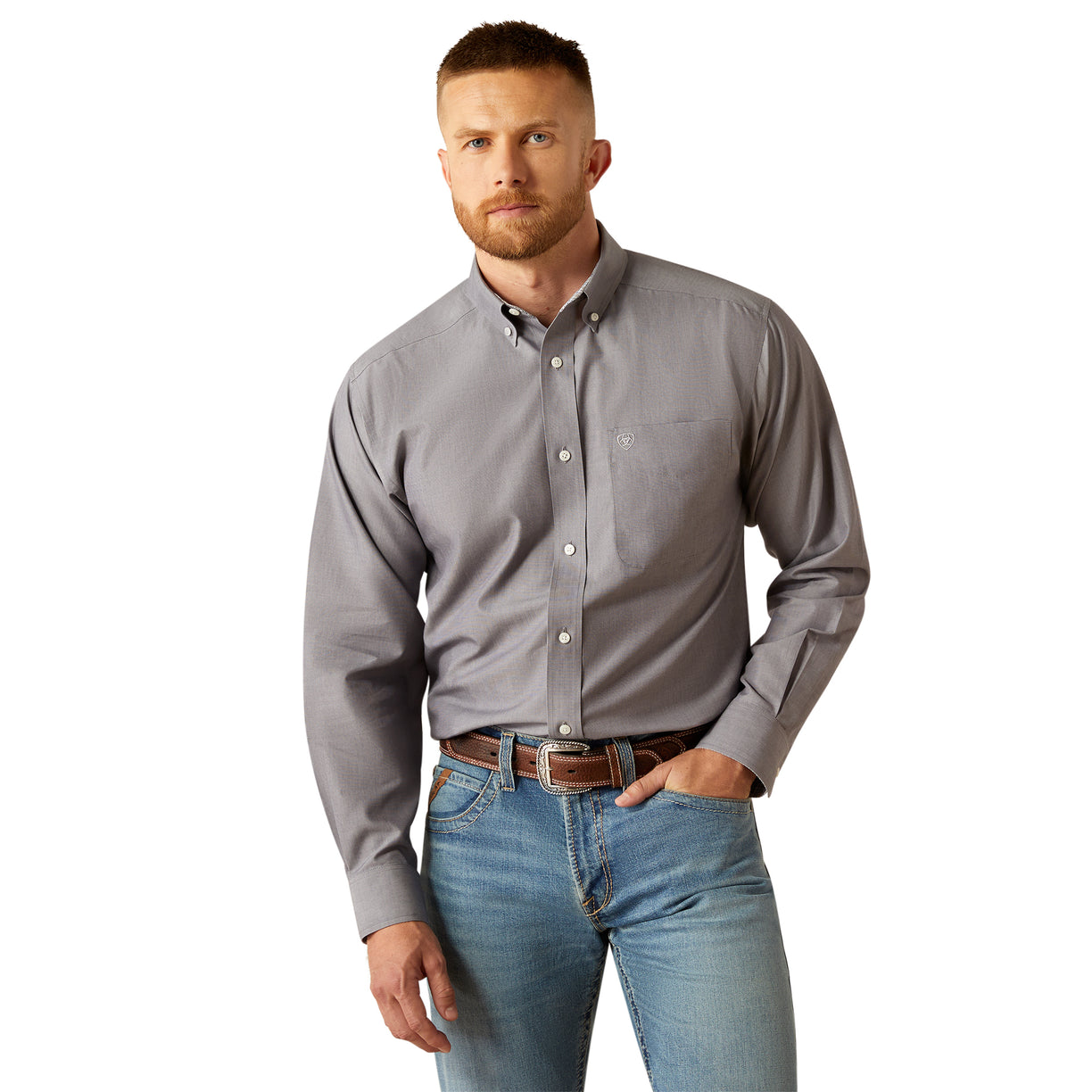 Man wearing a gray button-up shirt and blue jeans on a white background