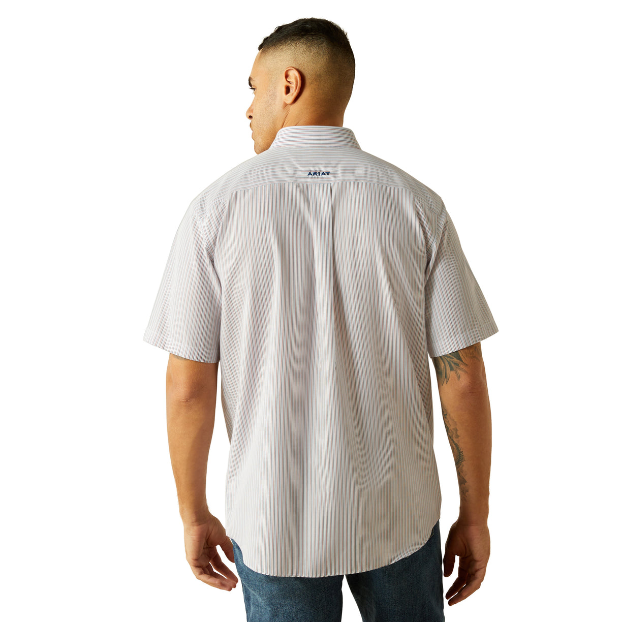 Man wearing a white striped shirt with a visible brand logo on the back, standing against a white background.