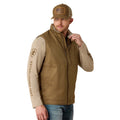 Man wearing a brown vest and cap on a white background